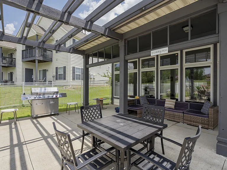 Enjoy meals or unwind outdoors in a shaded, comfortable patio space designed for connection and relaxation.