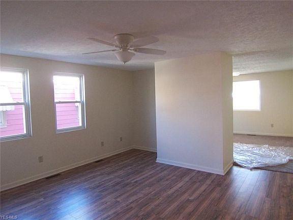 Dining room with new floor and freshly painted walls and trim plus all new windows throughout the home!