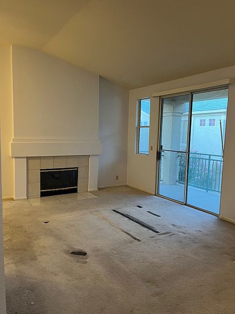 Living room, fireplace and access to balcony.
