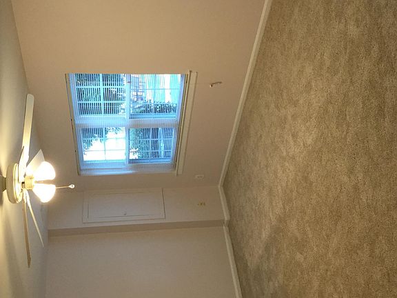 large, sunny living room with two big windows
