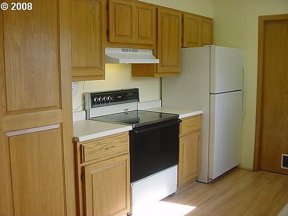 1 Year old refrigerator stays.  Glass top range.
