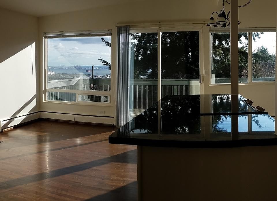 Open living room, dining area and kitchen with view