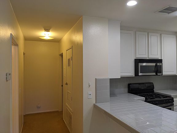 Central heat and air conditioning, new carpet being installed, two bedrooms, two bathrooms. Living room off the kitchen.