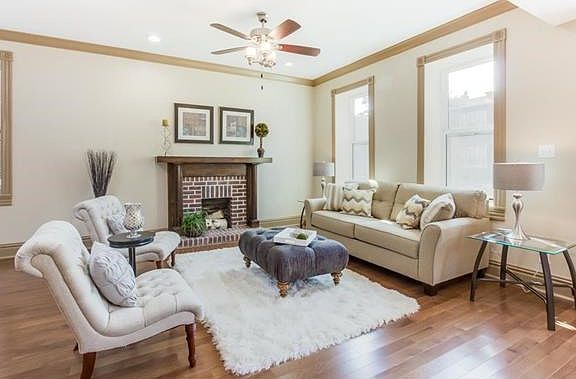 Living room with a functional fireplace.