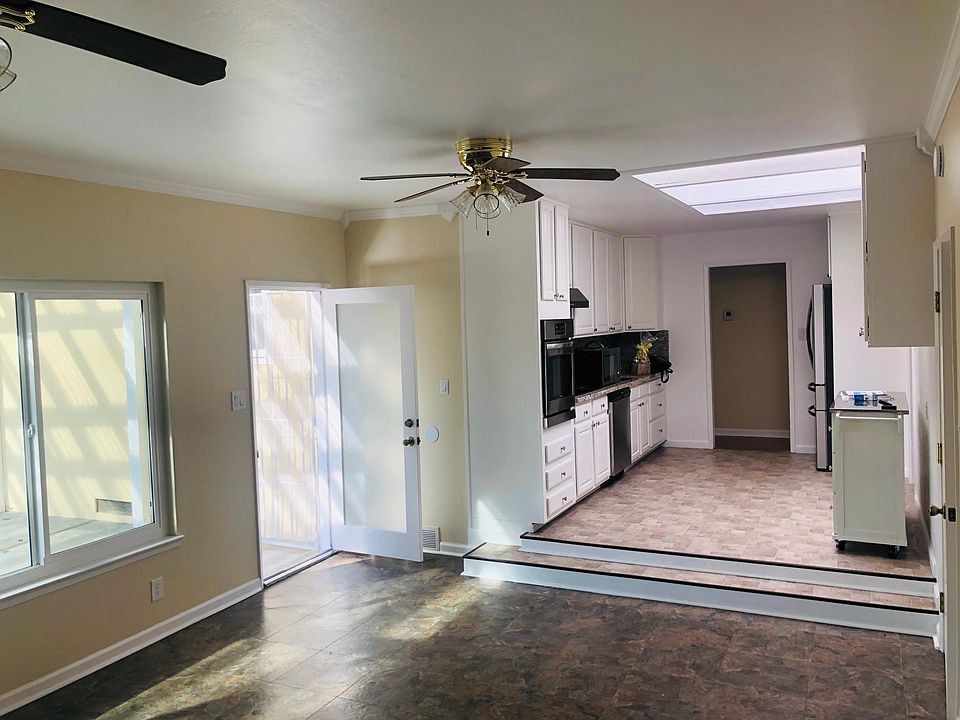 This is the Kitchen and family room opening into the beautiful backyard. The kitchen has a sunlight roof that brings in lots of light and energy.