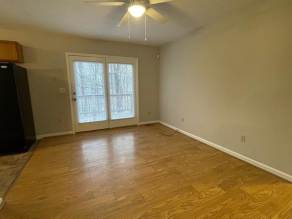 Dining Area with doors that lead to a private deck overlooking a natural wooded area