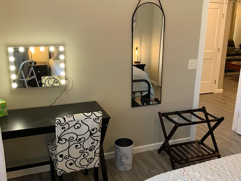 A view of the desk, chair, make-up mirror, and full length mirror in the Grand Canyon Room.