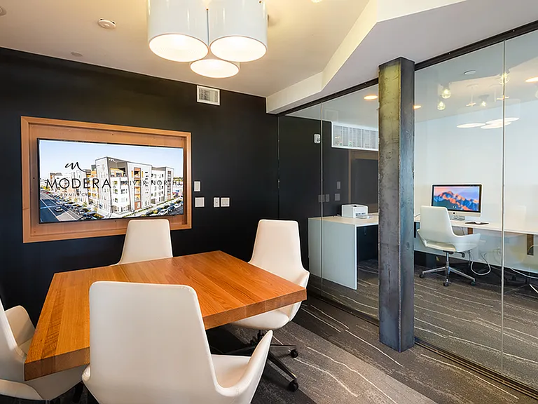 Intimate resident conference center with floor to ceiling windows near business center