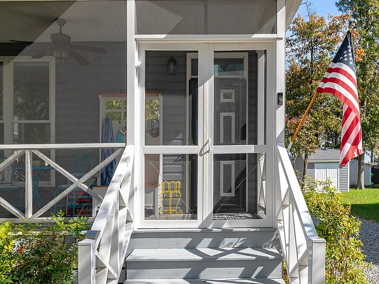 Enjoy relaxing on the three season front porch. A great place to start or end the day.