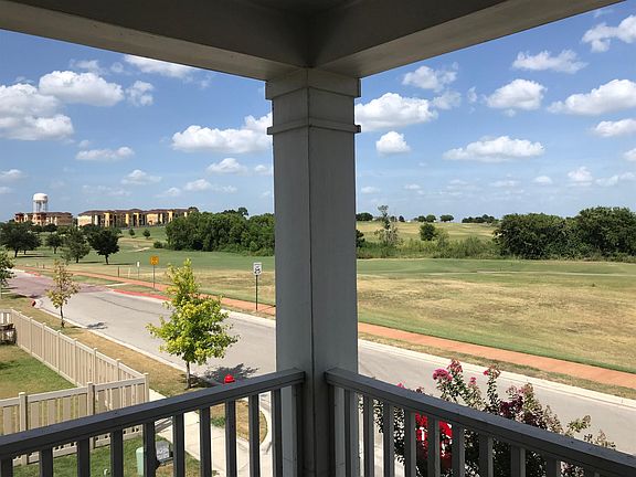 Balcony view looking north toward Windy Hill and the par 5 golf hole.