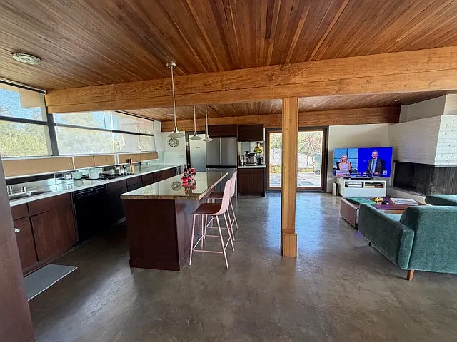 Beautifully refinished concrete floors enhance the home's contemporary design.