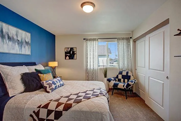 Comfortable Bedroom with Blue Accent Wall