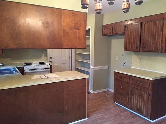 Kitchen has electric stove, dishwasher, disposal and side by side refrigerator ( not pirctured) A full pantry with louvred doors