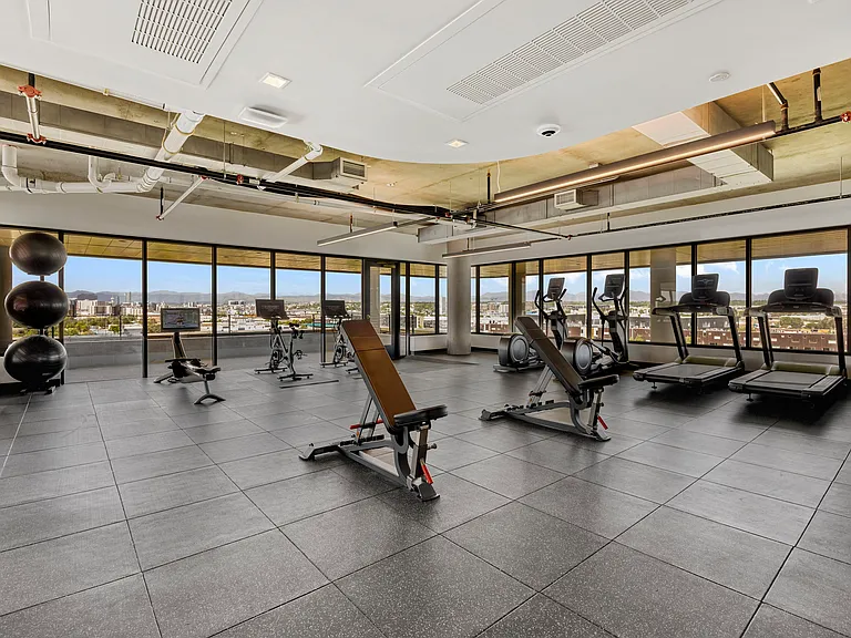 Massive gym overlooking the city and mountains