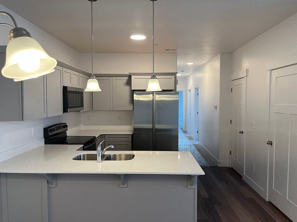 Kitchen with brand new refrigerator with ice maker.