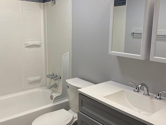 Brand new vanity with new faucets, new toilet, LED fan light and light bar.