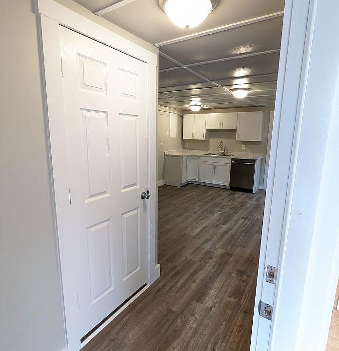 House entry. Bedroom through door on left.