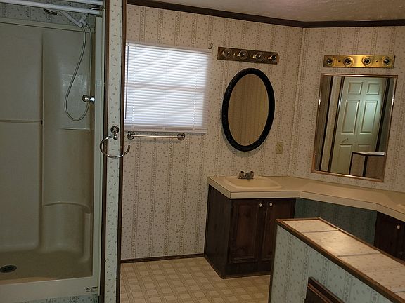 Master bath has a shower and a big garden tub with two sinks