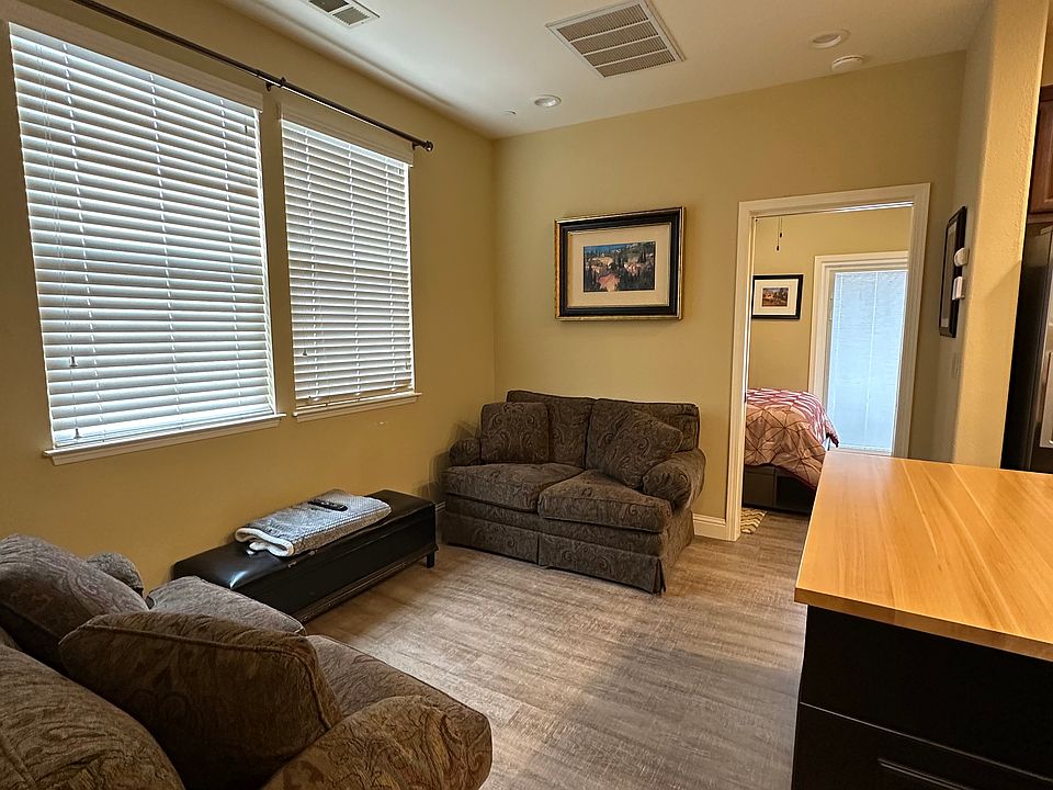 living room area looking into bedroom