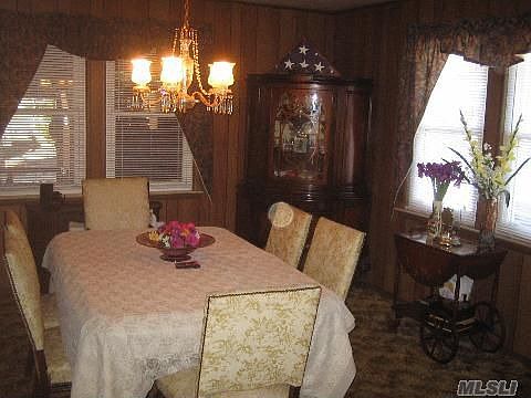 DINING ROOM OVERLOOKING REAR SUNROOM 