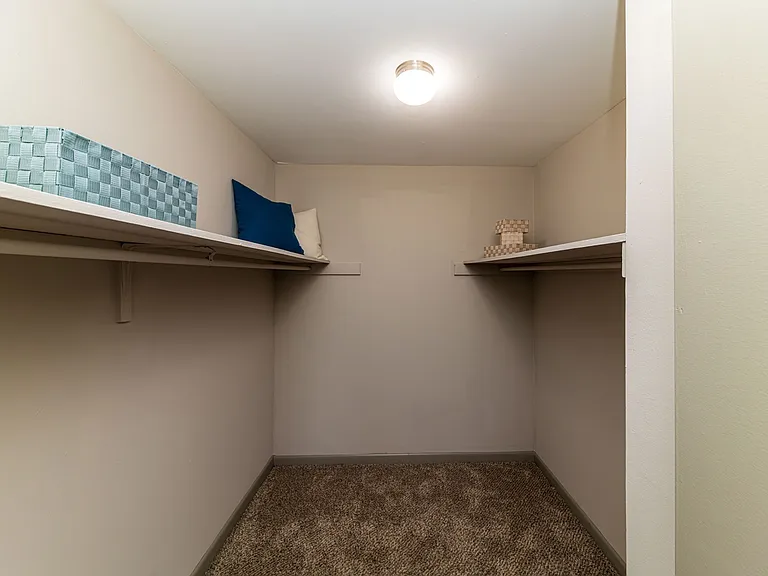 Generous closet space with built-in shelving