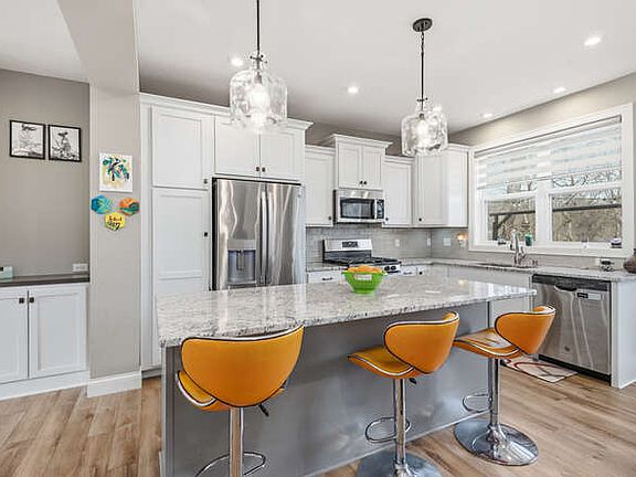 Gorgeous stone counter tops, stainless appliances, coffee nook