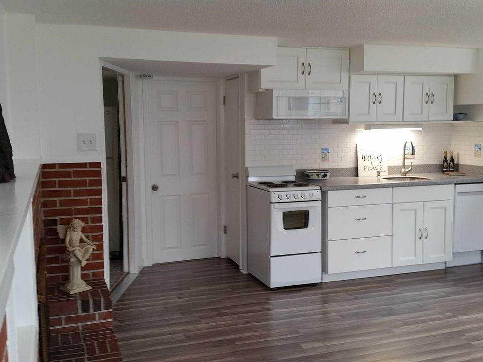 Main studio - like new kitchen - recent new appliances, cabinets, and built in microwave/range hood. Another closet in kitchen behind range for garbage, recycle bins, oven trays, and pans.