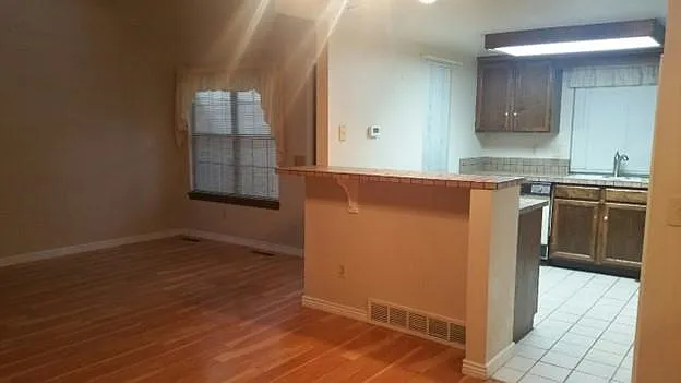 View from the Dining Room into the Kitchen and Living Room