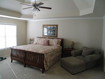 Large master with trey ceiling and crown molding.