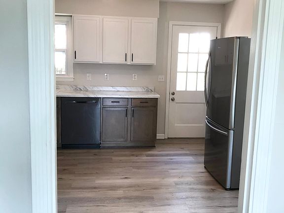 Kitchen includes new stainless steel appliances