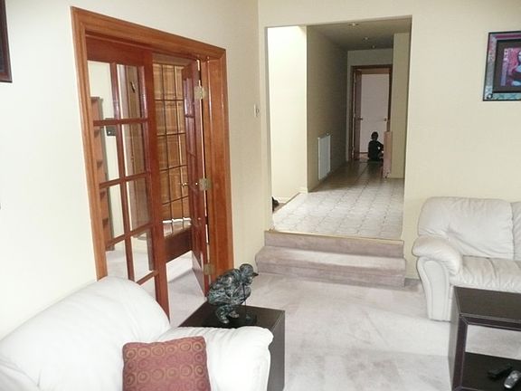 Living room with French doors to den/office.