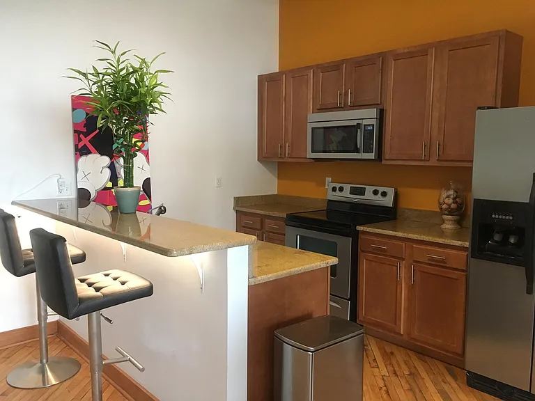 Kitchen with stainless steel appliances and slow-close cabinetry doors