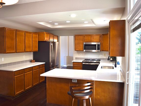 Esthetic and functional Kitchen with new stove & newer fridge, dishwasher, microwave & disposal. Beautiful Quartz Counters, new sink & faucet.