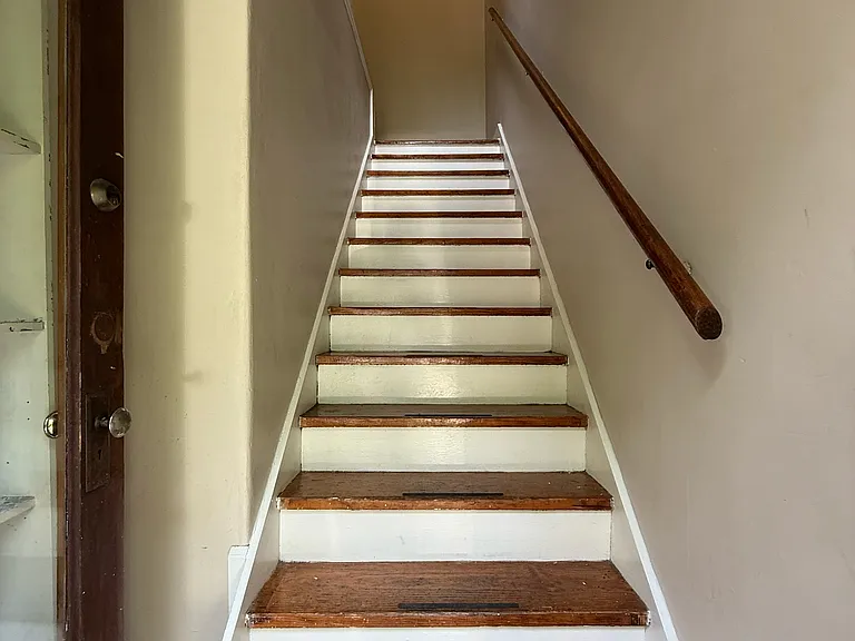 Stairway to 2nd floor unit