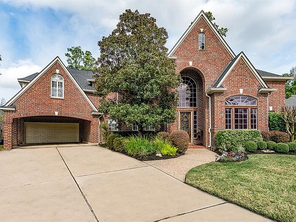Southern elegance abounds with the beautiful front elevation of the home. The 2 car porte-cochere is so convenient and the walkway welcomes you home.