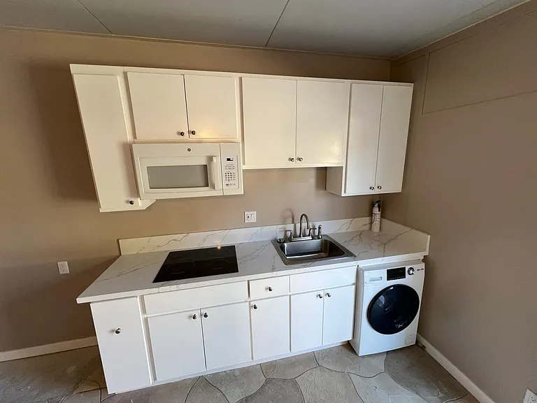 New cabinets with quartz counter.