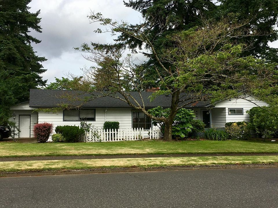 Corner lot home with beautiful mature trees.