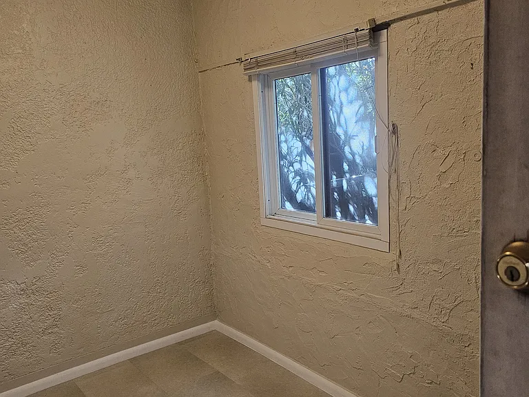 bedroom showing window and minisplit a/c