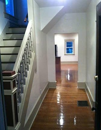 Foyer leading into open kitchen and dinning area