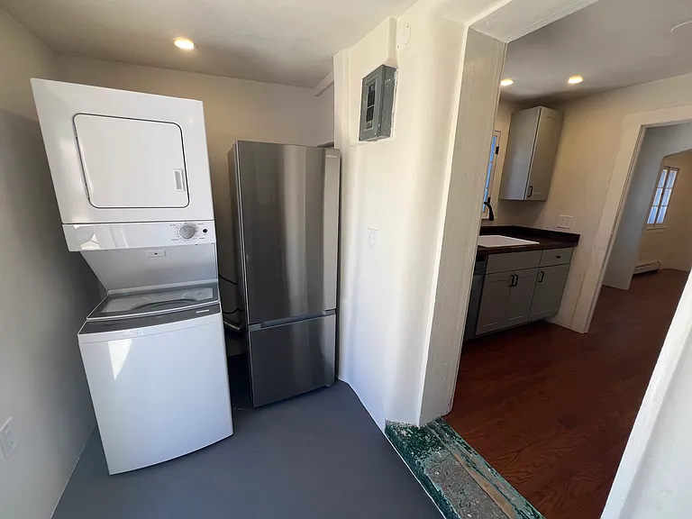 Mudroom contains on-demand water heater and a brand new washer dryer and refrigerator.