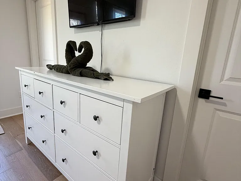 Unpack your things in our 8 drawer dresser and unwind with your smart tv with all streaming services.