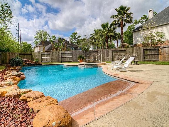 POOL - features a beach entry, picturesque waterfall, hot tub, and salt water system!