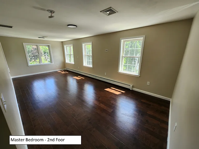 Primary bedroom, on 2nd floor, east facing on left, south on right. Great natural light.