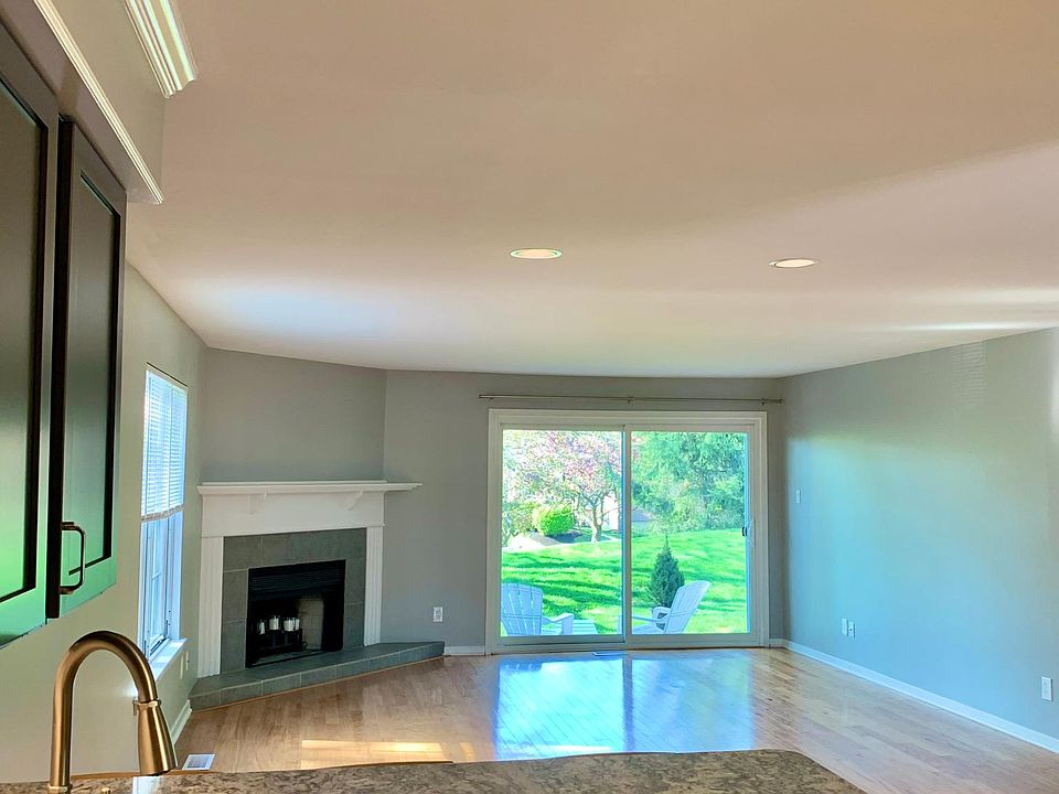 Brand new kitchen opens to the large living area with private patio overlooking Valley Forge mountain