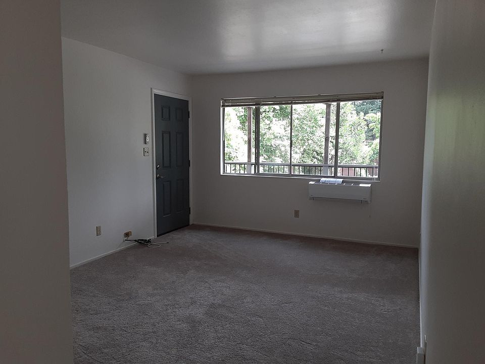 Living room facing front door and window.
