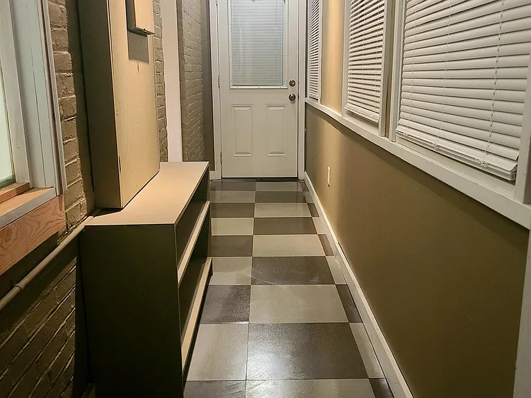Enclosed porch 2nd floor entrance at the back of the apartment