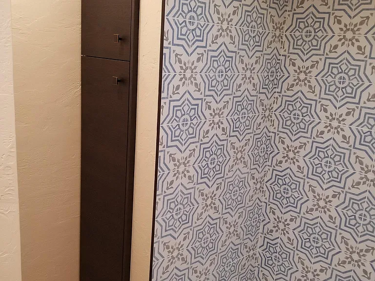 Deep storage tucked away for towels etc. Skylight makes it a bright and cheery place full of details.
