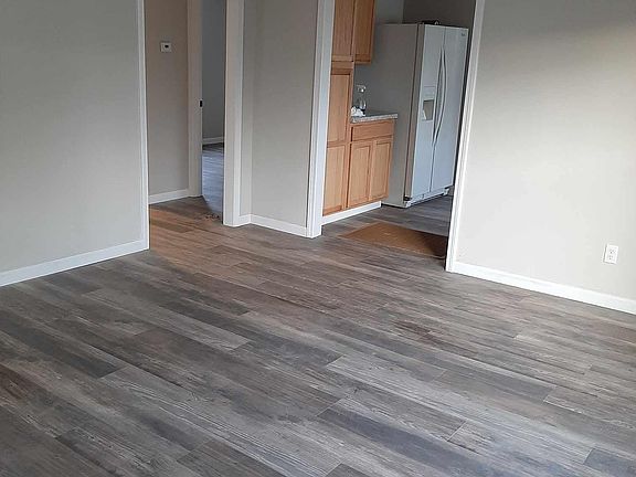 Living room looking into hall and kitchen.