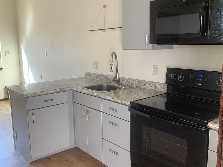 cute kitchen with clean appliances