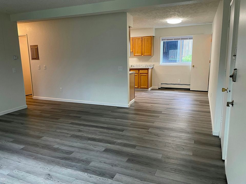 Living Room with a view of the dining area and kitchen